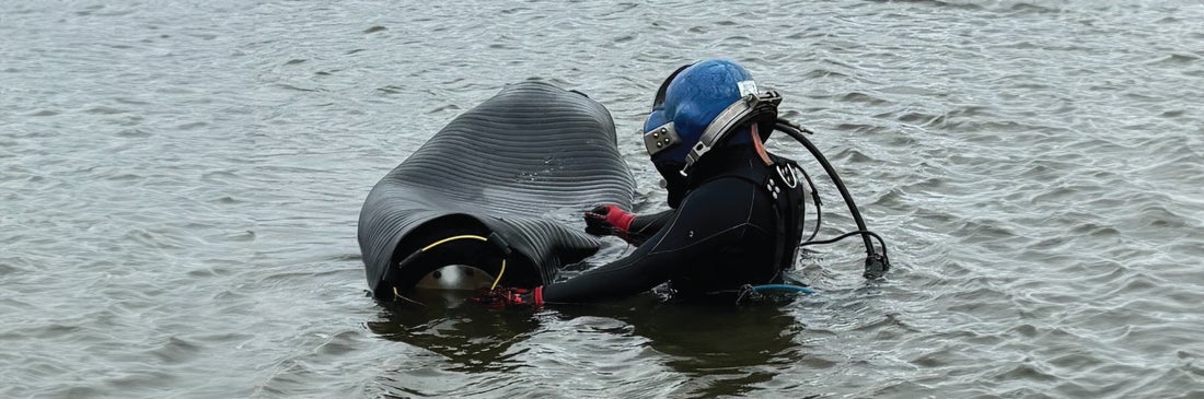 Diver working with a Cherne pipe plug